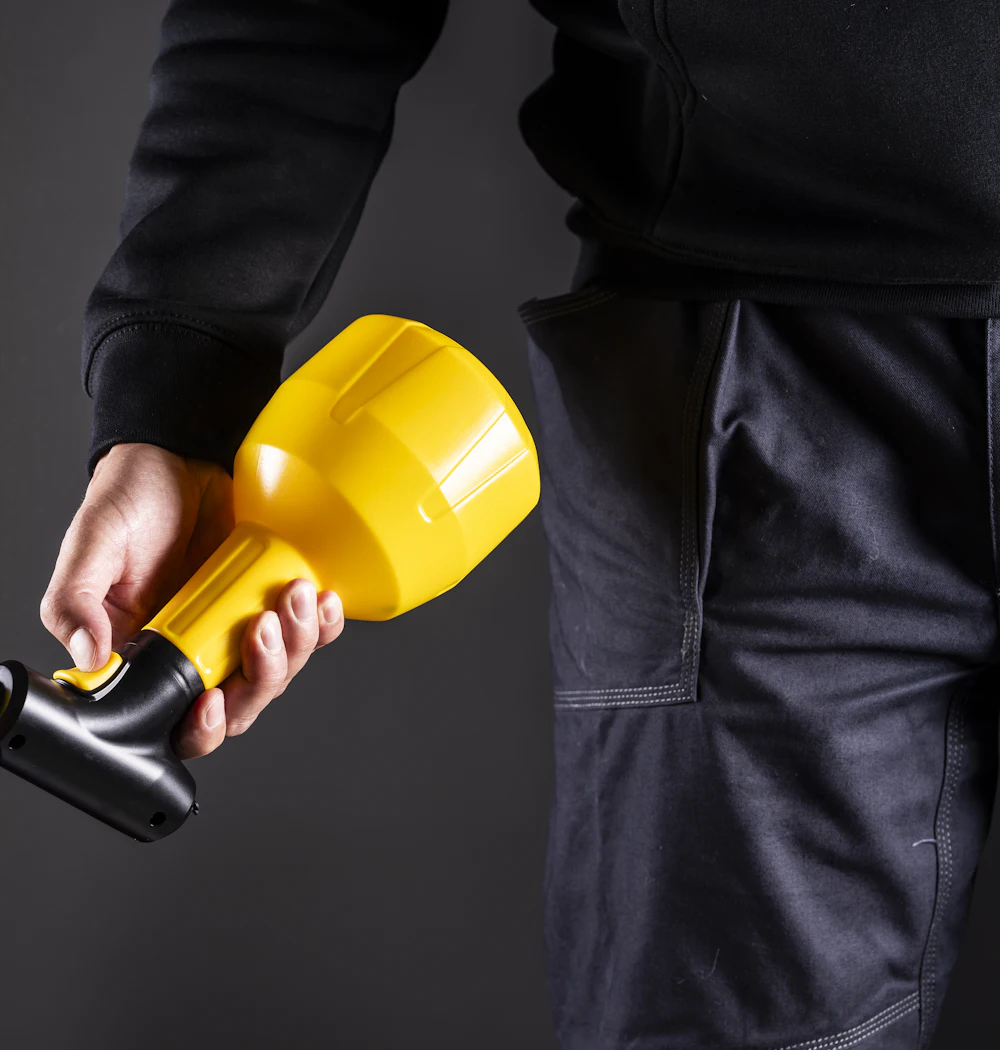 A technician applying a fine spray treatment
